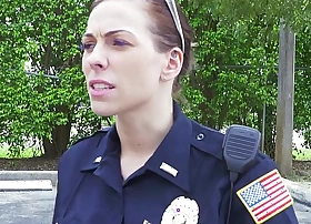 Female cops captivate over unscrupulous suspect and suck his cock