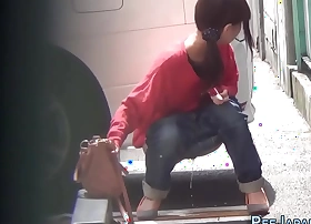 Japanese slut urinating in regurgitate street