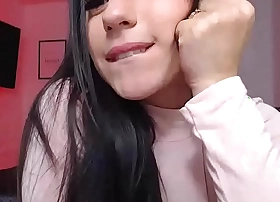 Busty clothed camgirl sucks vibrator