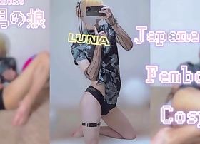 A blonde femboy in a seductive Chinese dress enjoys solo masturbation during a steamy selfie session.