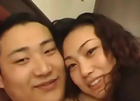 A seductive Chinese beauty not far from curly plaits and voluptuous breasts, exuding outlander allure.